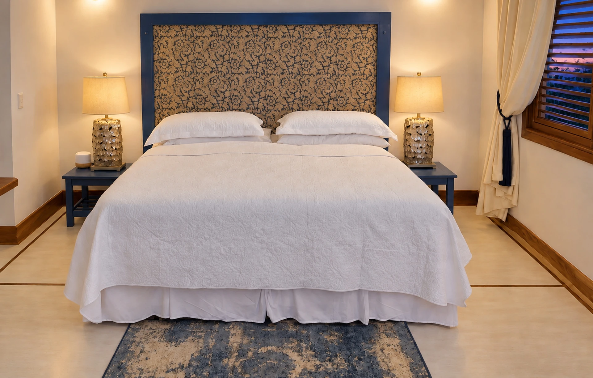 A bedroom at Villa Alborán, with a blue headboard